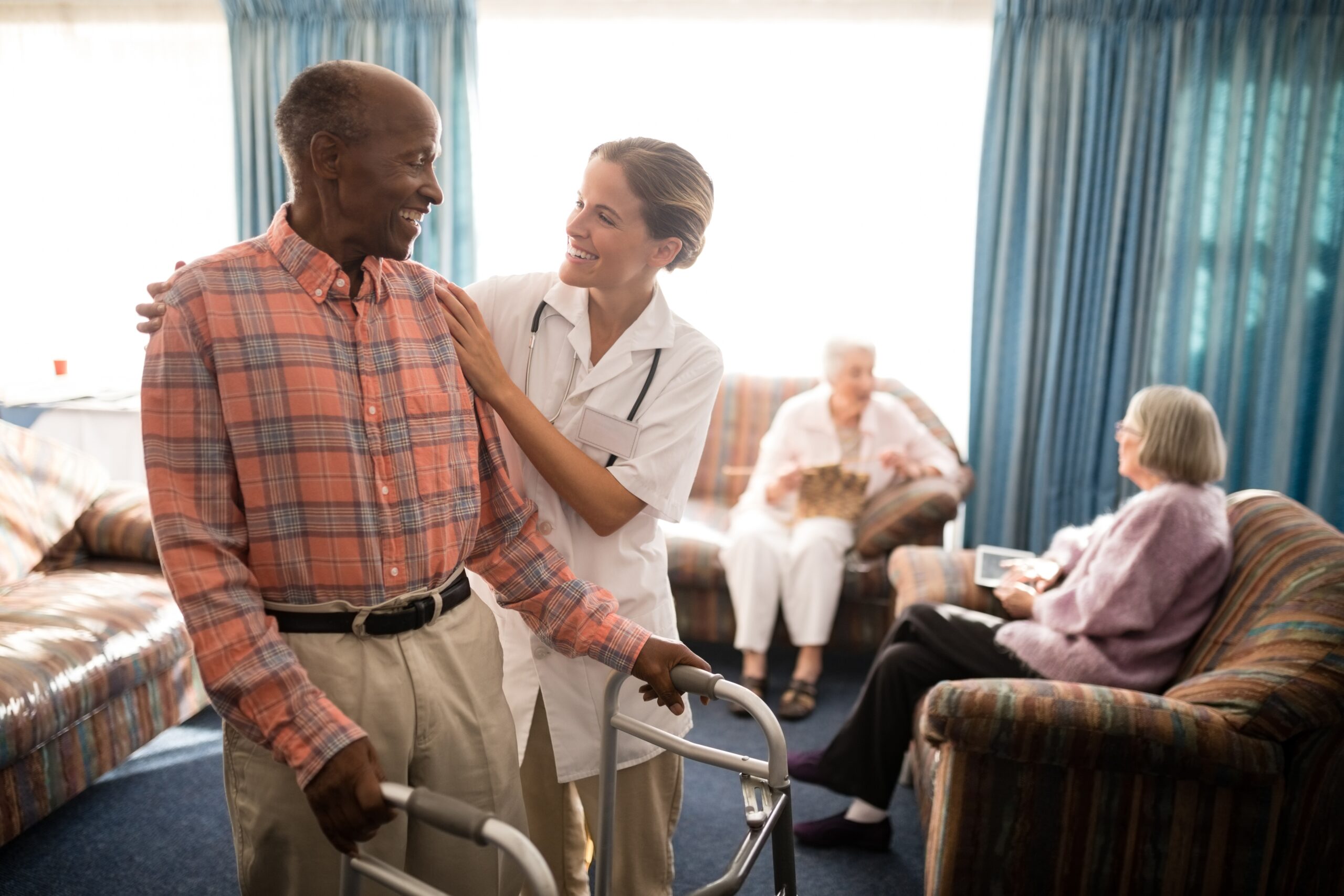 Briarcliffe RI Assisted living and memory care man smiling with care provider